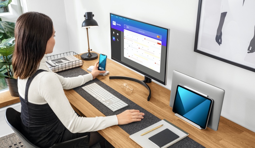 woman using StudioCaddy at desk small