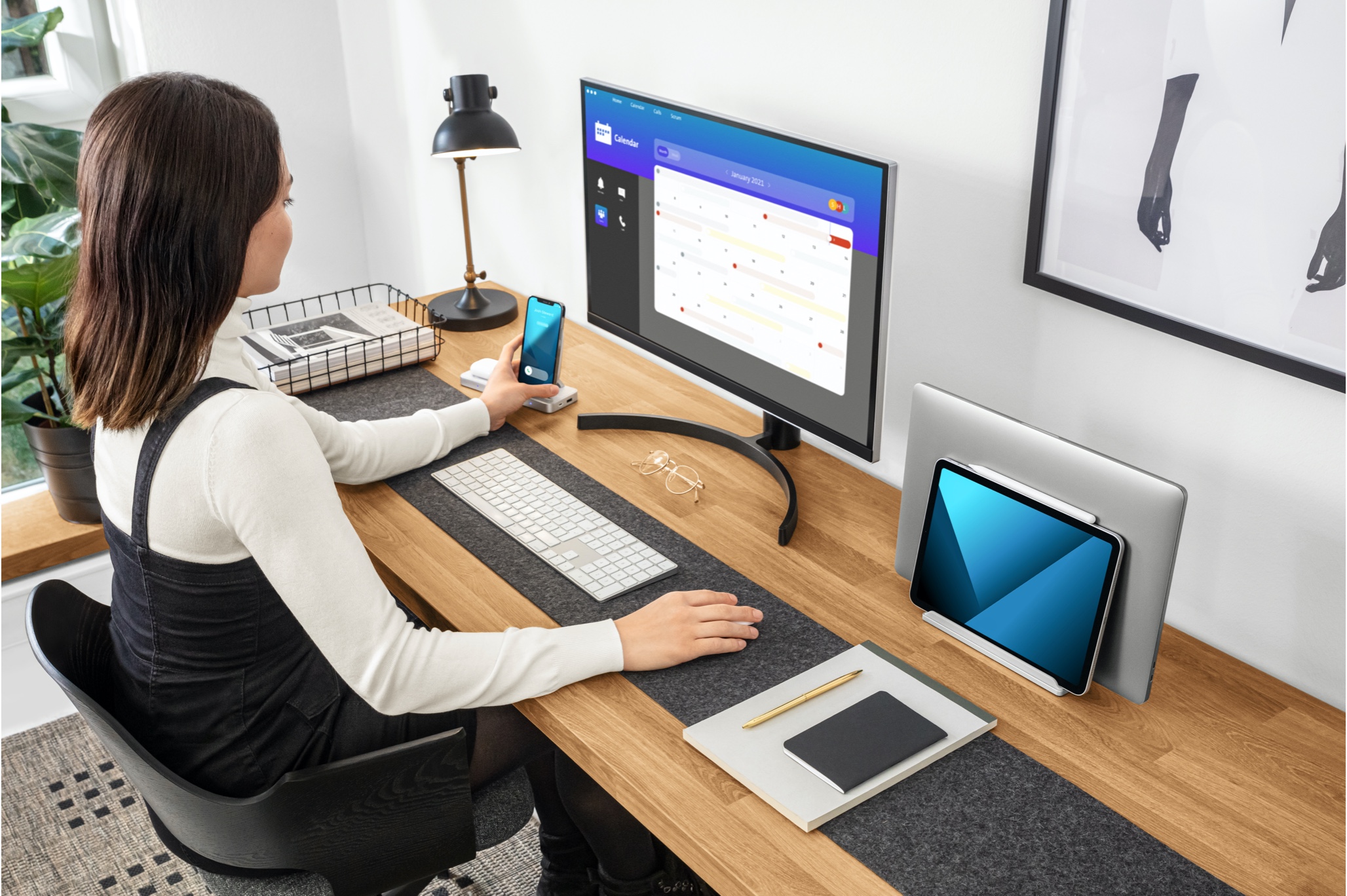 woman using StudioCaddy at desk