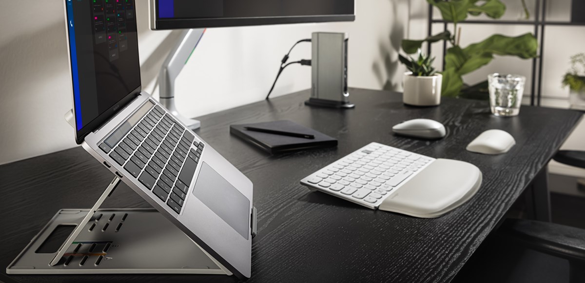 Kensington laptop riser on a black wooden desk