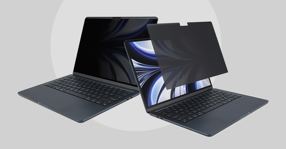 Laptops with Kensington Laptop Privacy Screens on a gray background