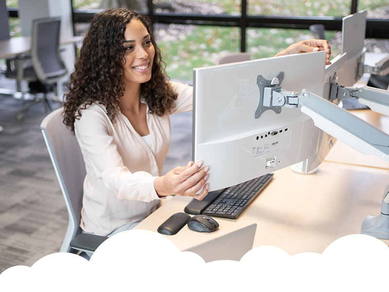 Woman using monitor arms