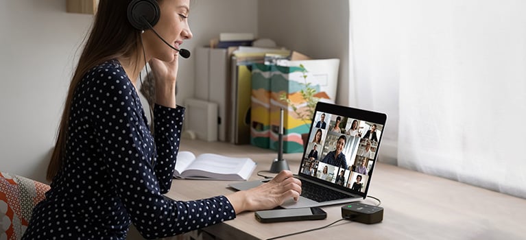 Person using Kensington audio switch during virtual meeting