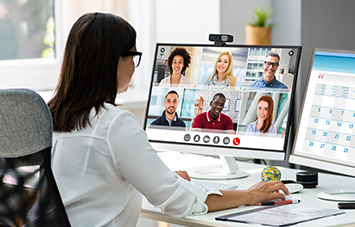 Person using Kensington webcam during virtual meeting