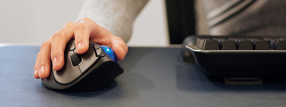 Man using the TB450 trackball.