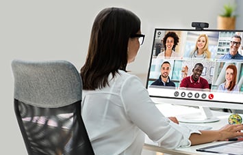 Woman on a virtual meeting using a Kensington webcam