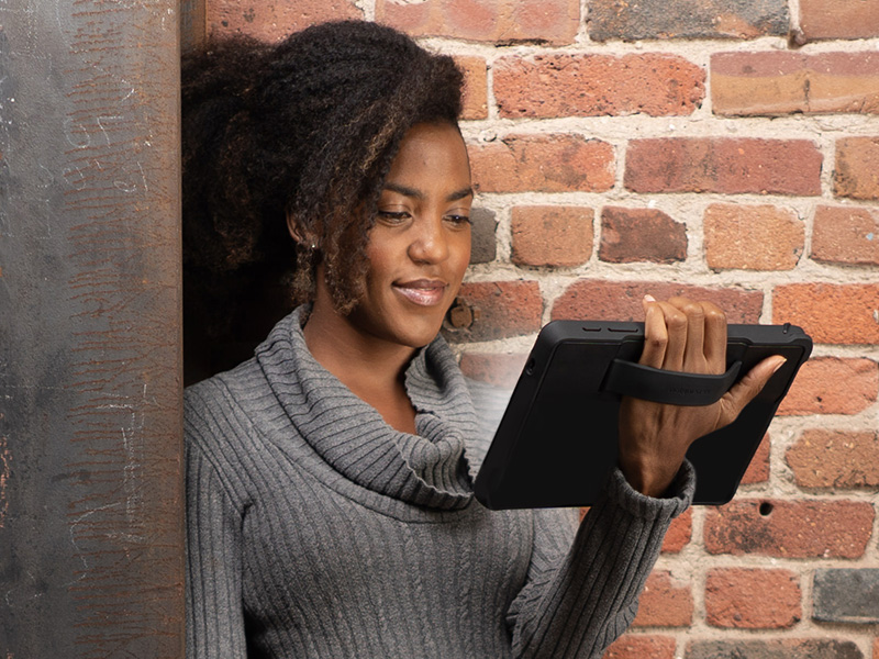 Woman looking at iPad with a Kensington case