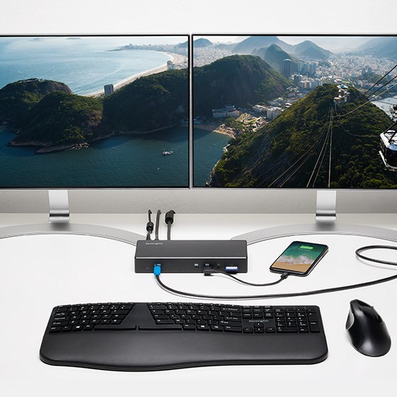 a docking station that seamlessly connects two monitors, a laptop, and a wired headphone.