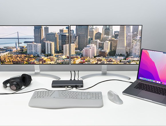 a Thunderbolt desktop docking station connected to a MacBook Pro Max. 