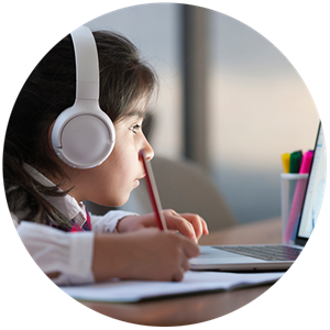 Child with headphones doing school work