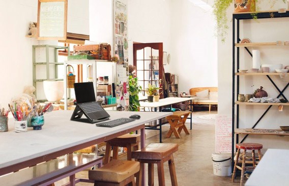Open office with Kensington laptop riser on white background