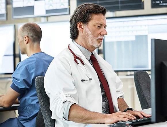 Blog: Healthcare professional using Kensington Privacy Screen to safeguard sensitive data.