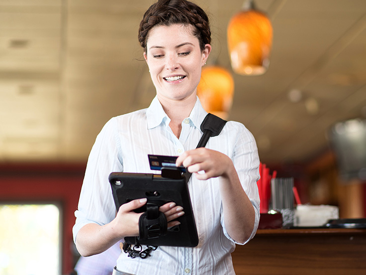 Woman using a tablet with a Kensington case