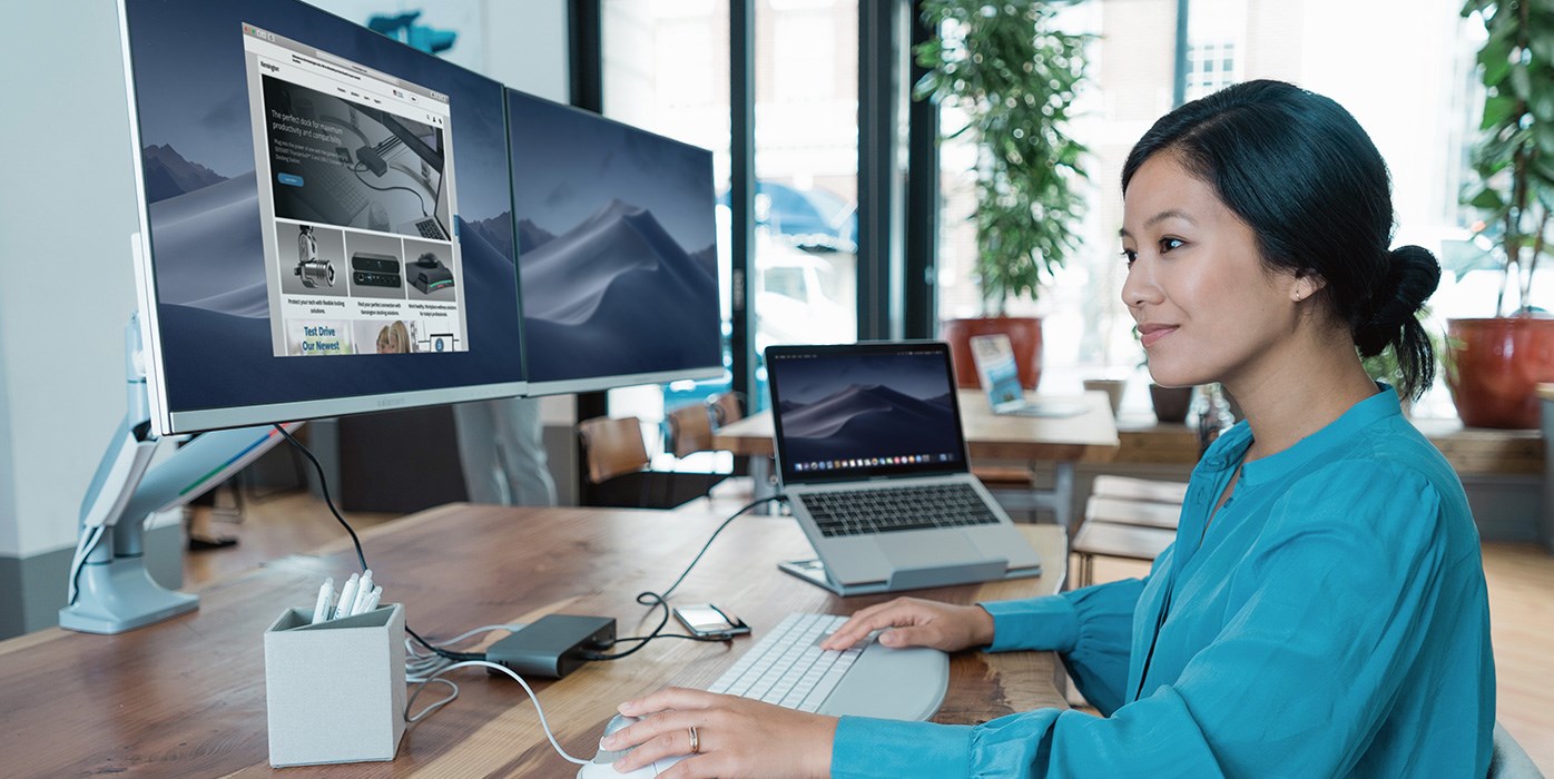 Woman at desk with monitor arm